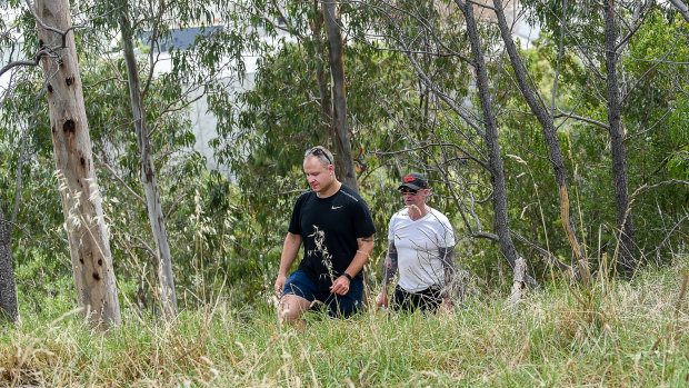 Officers from the missing persons unit search Darebin Creek Reserve on Thursday.