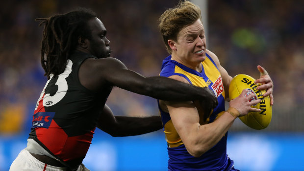 Anthony McDonald-Tipungwuti of the Bombers tackles Jackson Nelson of the Eagles.