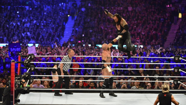 Wrestling legends: Triple H (L) beat The Undertaker (R) in the duo's last ever match. 
