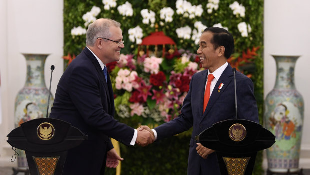 Prime Minister Scott Morrison with Indonesian President Joko Widodo at the Presidential Palace on Friday night.