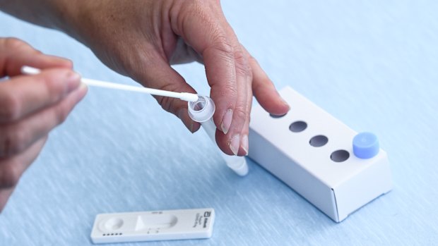 A rapid antigen test for COVID-19 being administered at home.