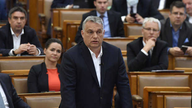 Hungarian Prime Minister Viktor Orban replies to an oppositional MP during a question and answer session of the parliament in Budapest, Hungary.