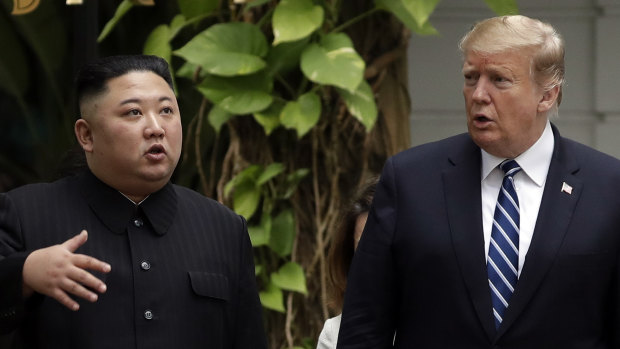 Kim Jong-un and Donald Trump go for a walk in the garden after their first meeting in Hanoi.