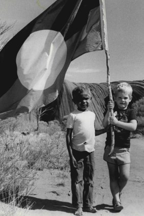 Richard Morton (left) and Simon McKay at Uluru for the historic handover.