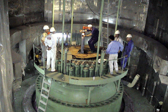 Technicians work in the reactor of Iran's Bushehr nuclear power plant in a file picture, released by Iran's Atomic Energy Organization.
