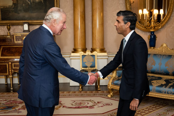 King Charles welcomes British Prime Minister Rishi Sunak during an audience at Buckingham Palace.