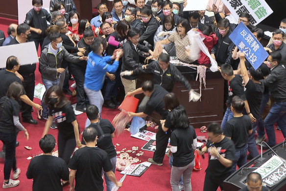 Taiwan's legislators got into a fist fight and threw pig guts at each other over a soon-to-be enacted policy that would allow imports of US pork and beef.