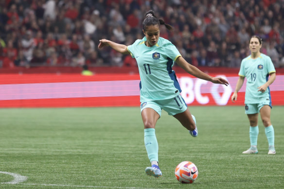 Mary Fowler strikes the ball during the first-half.