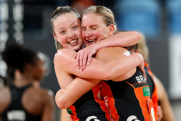 Giants Sophie Dwyer and April Brandley embrace at fulltime.