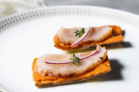 Salt-cured kingfish pancetta tostadas with mojo rojo.