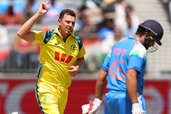 Josh Hazlewood of Australia celebrates the wicket of Rohit Sharma. 