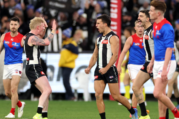 Nick Daicos was well held but celebrates a goal. 