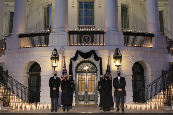 President Joe Biden, first lady Jill Biden, Vice-President Kamala Harris, and Doug Emhoff during a candle-lit White House ceremony to honour the 500,000 Americans who died from COVID-19.