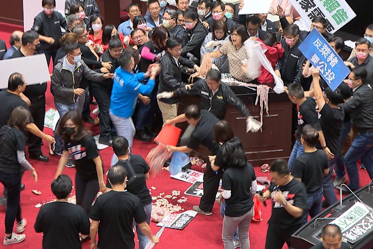 Fists and pig guts fly in Taiwan Parliament debate on US pork imports