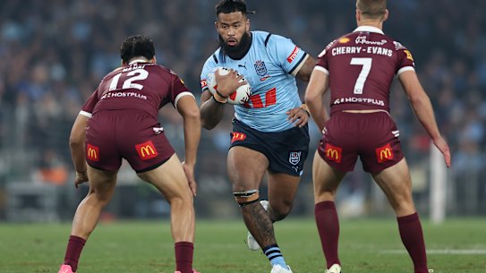 Payne Haas takes a carry.