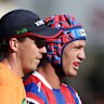 Kalyn Ponga is helped off the field with a hamstring injury.