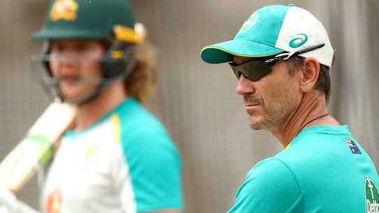 Justin Langer watches on as Will Pucovski trains in the nets.