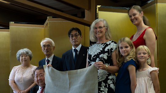 Tasmanian convict descendant Julie Findlay (centre) and her family pictured with descendants of the samurais who repelled the Cyprus.