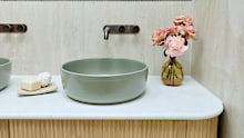 A highlight of the room was their matching green ceramic sinks. 