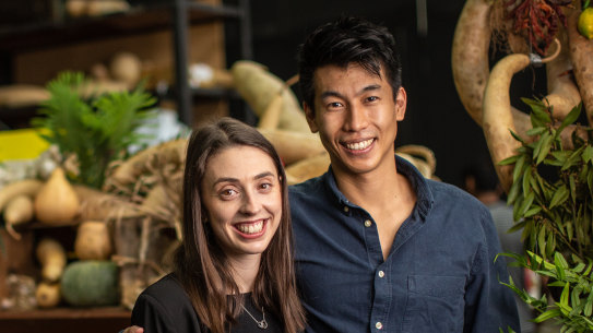 Andrew Jiang and partner Jess Welk (pictured at the Prahran Market) have moved home to Melbourne permanently because of the COVID-19 crisis in the United Kingdom.