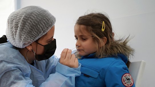 Suzanne, 5, is tested for COVID-19 in Albigny-sur-Saone, north of Lyon.