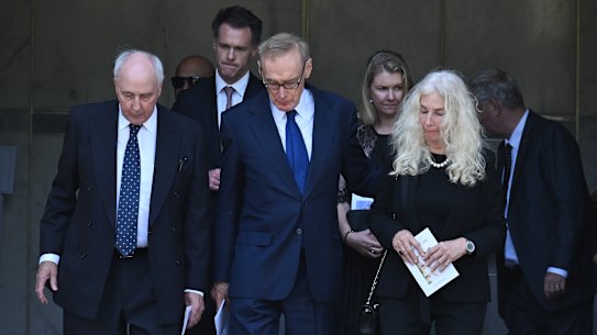 Former NSW premier Bob Carr (centre) with former prime minister Paul Keating and his former wife Annita van Iersel and current NSW Premier Chris Minns and his wife Anna leave the requiem mass for Helena Carr.