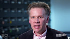 A screenshot of former economics professor Chris Edmond being interviewed on television.