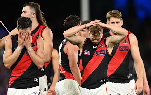 A dejected Essendon leave the field after their loss to the Western Bulldogs.