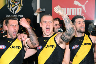 Jack Graham (left) with Dustin Martin and Trent Cotchin, after the Tigers beat the Cats in last week's preliminary final. 