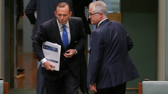 Then prime minister Tony Abbott and communications minister Malcolm Turnbull leave the chamber at the end of question time just before the leadership spill was called on September 14, 2015. 