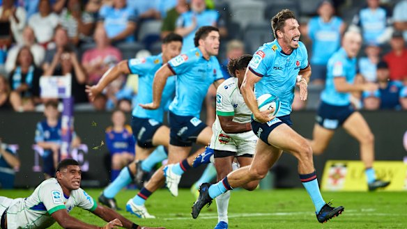 Jake Gordon makes a break for the Waratahs against the Fijian Drua at CommBank Stadium.