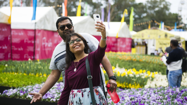 People come to take selfies in front of the flower beds at Floriade.