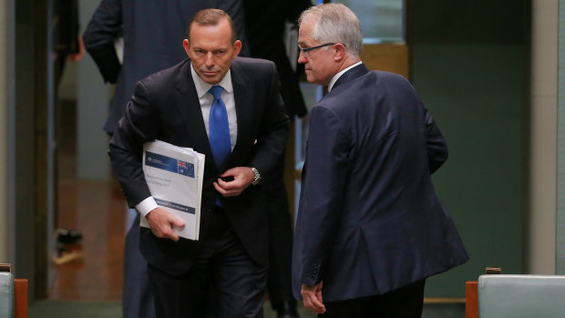 Then prime minister Tony Abbott and communications minister Malcolm Turnbull leave the chamber at the end of question time just before the leadership spill was called on September 14, 2015. 