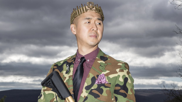 Pastor Hyung Jin "Sean" Moon, leader of Sanctuary Church, wears a crown of rifle shells and holds a gold-plated AR-15.