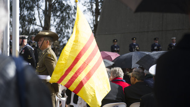 A flag of the former South Vietnam flies at the Vietnam War remembrance ceremony.
