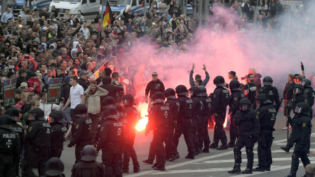 Protesters light fireworks during a far-right demonstration in Chemnitz, Germany, in August.