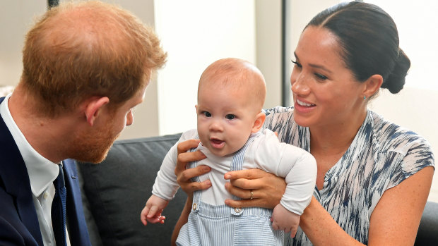 Harry and Meghan tend to their four-month-old son Archie during their meeting with Archbishop Desmond Tutu.