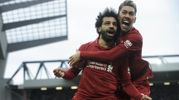 Liverpool's Mohamed Salah, left, and Roberto Firmino celebrate after Tottenham's Toby Alderweireld's own goal. 