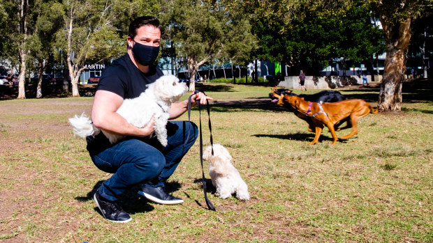 Christopher Jewell, with his Moodles Tiger and Lilly, wants a park designated as off-leash for smaller dogs.