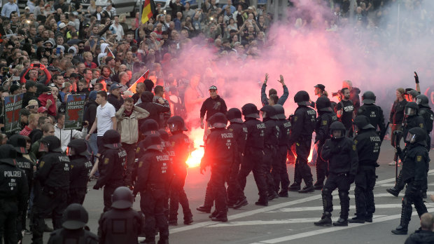 Protesters light fireworks during the far-right demonstration in the German city of Chemnitz.