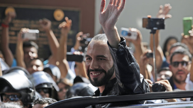 Presidential hopeful Nayib Bukele waves as he leaves a polling station after casting his vote in the presidential election in San Salvador on  Sunday.