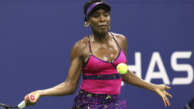 Venus Williams returns a shot.