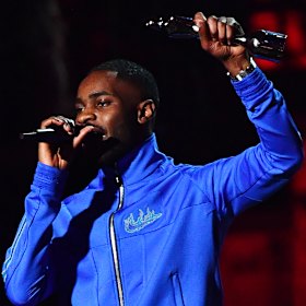 Dave accepts the album of the year at the Brit Awards.