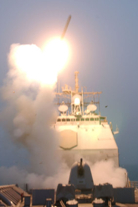 The first Tomahawk missile to be fired into Iraq is launched from the USS Bunker Hill.