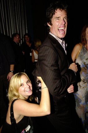 Megan Fowler pounces on Ronn Moss  at a radio function in 2004.
