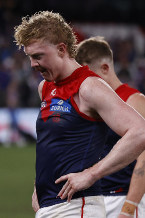 A dejected Clayton Oliver leaves the field after Friday night’s match.