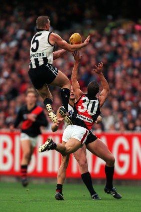 Nathan Buckley soaring over Mark Fraser.