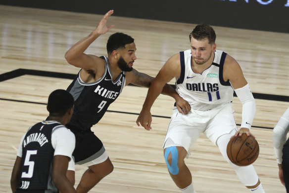 Luka Doncic drives against the Kings.