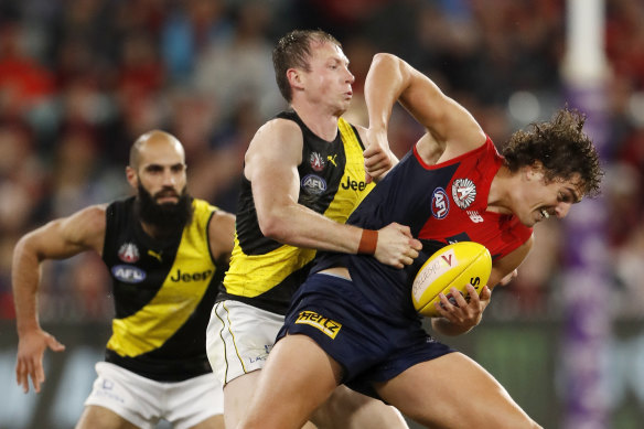 Dylan Grimes tackles Melbourne’s Luke Jackson during Saturday’s clash. 