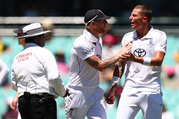 Stokes pushes away Carse before having words with the on-field umpire.